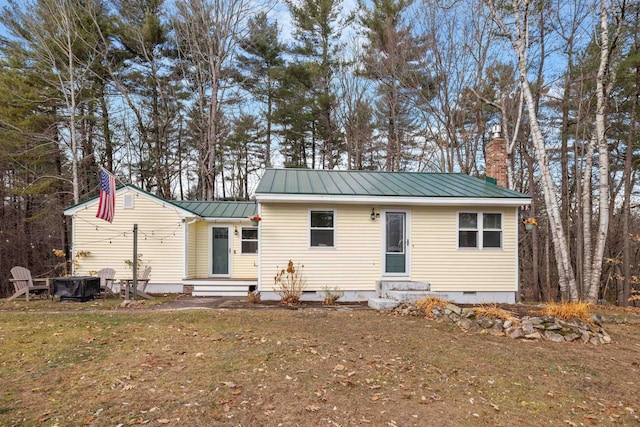 21 Regis Rd, Laconia, NH 03246 - rear view of property with entry steps, crawl space, a chimney, a standing seam roof, and metal roof