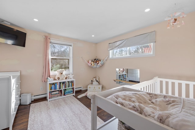 21 Regis Rd, Laconia, NH 03246 - bedroom with dark wood-type flooring, a baseboard radiator, and recessed lighting