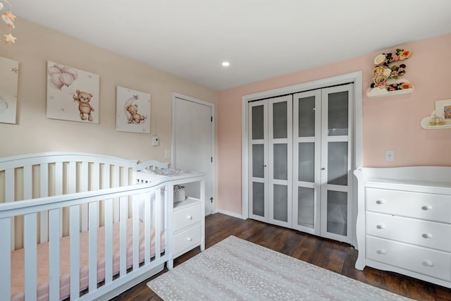 21 Regis Rd, Laconia, NH 03246 - bedroom with dark wood finished floors, recessed lighting, and a crib