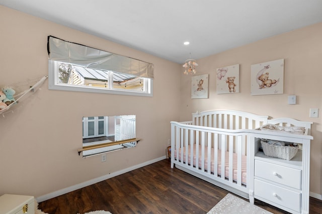 21 Regis Rd, Laconia, NH 03246 - bedroom featuring wood finished floors, baseboards, a chandelier, a crib, and recessed lighting