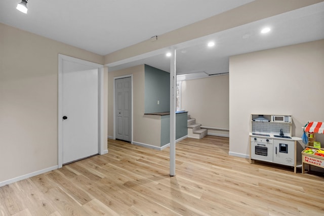 21 Regis Rd, Laconia, NH 03246 - finished basement with stairs, recessed lighting, light wood-type flooring, and baseboards