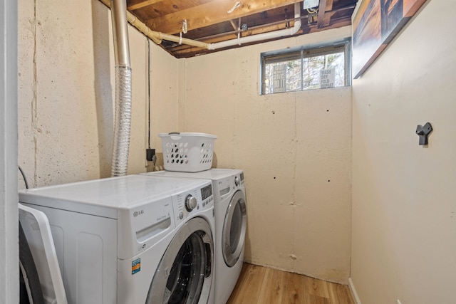 21 Regis Rd, Laconia, NH 03246 - laundry room featuring washer and clothes dryer and light wood-style flooring