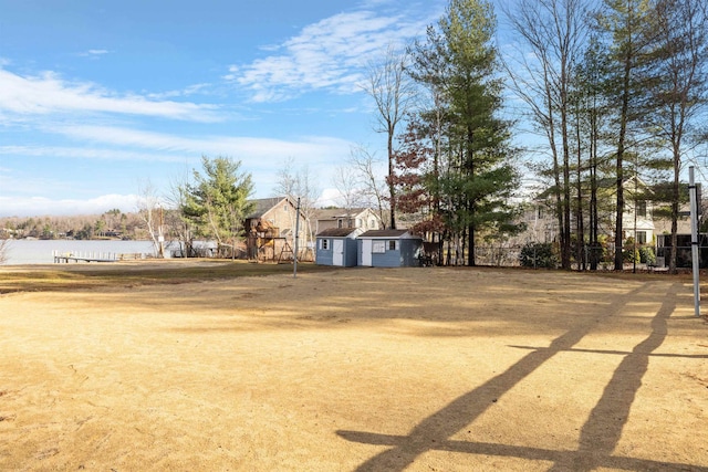 21 Regis Rd, Laconia, NH 03246 - view of yard featuring a water view and an outdoor structure