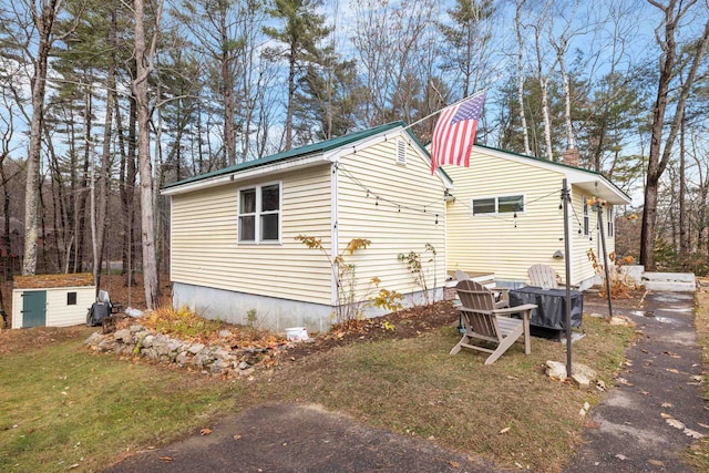 21 Regis Rd, Laconia, NH 03246 - view of side of property featuring an outdoor structure