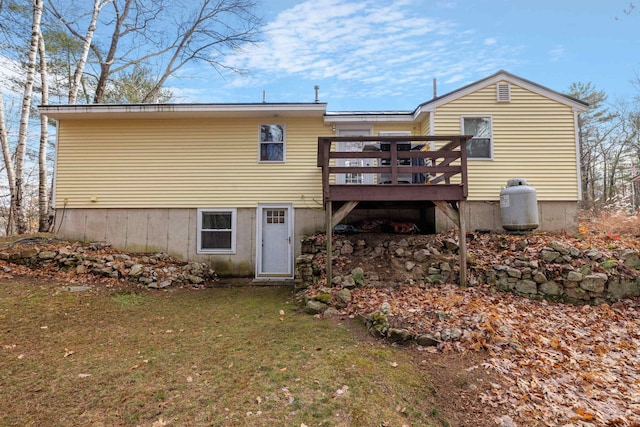 21 Regis Rd, Laconia, NH 03246 - rear view of property with a wooden deck and a lawn
