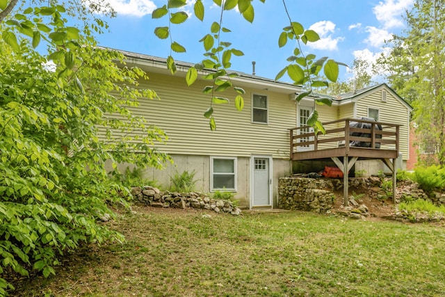 21 Regis Rd, Laconia, NH 03246 - back of house with a wooden deck and a lawn