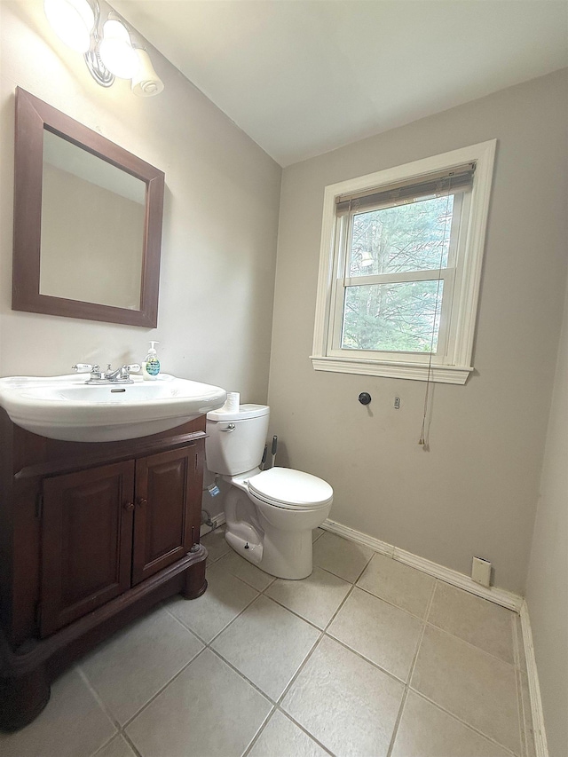 16 Townhouse Rd, Allenstown, NH 03275 - half bathroom featuring tile patterned flooring, toilet, vanity, and baseboards