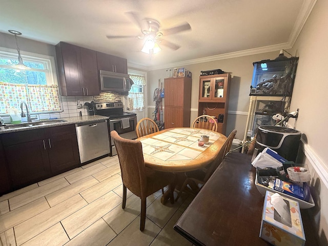 16 Townhouse Rd, Allenstown, NH 03275 - dining space with plenty of natural light, ceiling fan, and crown molding