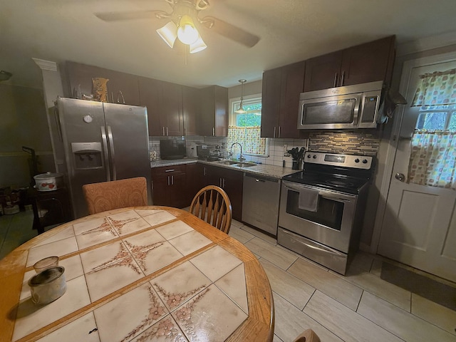 16 Townhouse Rd, Allenstown, NH 03275 - kitchen with appliances with stainless steel finishes, a sink, tasteful backsplash, a ceiling fan, and dark brown cabinetry