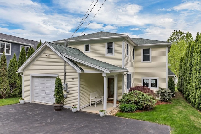 90 Paugus Park Rd, Laconia, NH 03246 - view of front facade featuring asphalt driveway, an attached garage, a front lawn, and a shingled roof