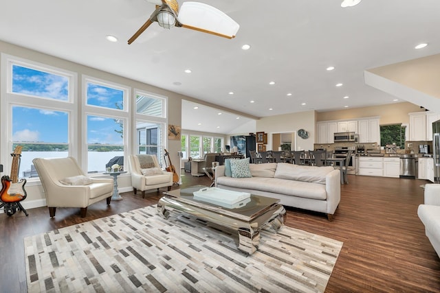 90 Paugus Park Rd, Laconia, NH 03246 - living room featuring recessed lighting, ceiling fan, dark wood-style flooring, a water view, and vaulted ceiling