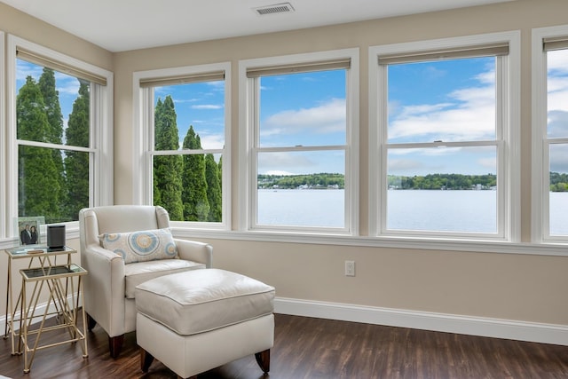 90 Paugus Park Rd, Laconia, NH 03246 - living area with dark wood-style floors, a water view, and baseboards