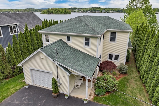 90 Paugus Park Rd, Laconia, NH 03246 - view of front of home featuring driveway, an attached garage, roof with shingles, and a front yard