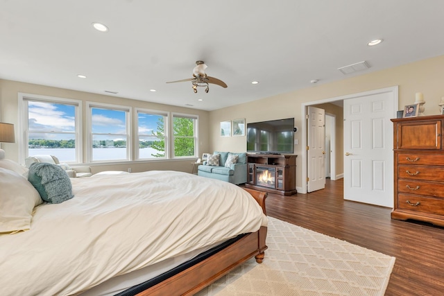 90 Paugus Park Rd, Laconia, NH 03246 - bedroom with dark wood-style flooring, ceiling fan, recessed lighting, and a water view