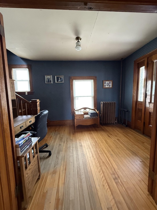 119 N Main St, Rutland City, VT 05701 - office space featuring radiator, light wood finished floors, and wallpapered walls