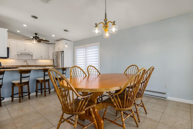 185 Kings Hwy, Hampton, NH 03842 - dining room featuring a baseboard heating unit, light tile patterned flooring, a ceiling fan, a chandelier, and baseboards
