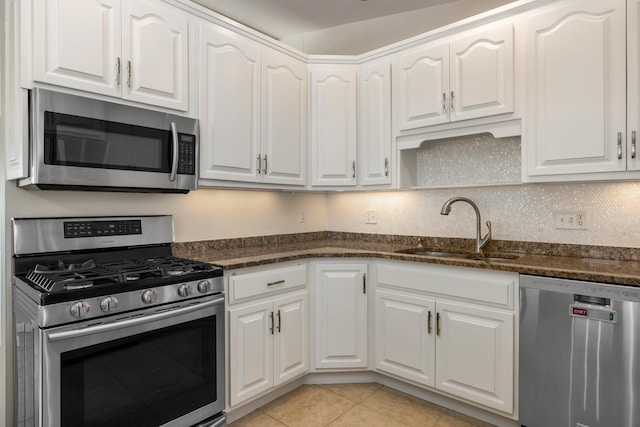185 Kings Hwy, Hampton, NH 03842 - kitchen with appliances with stainless steel finishes, a sink, and white cabinets