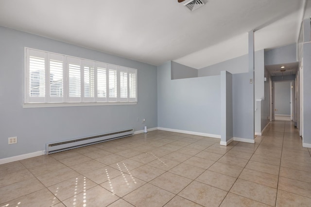 185 Kings Hwy, Hampton, NH 03842 - unfurnished room with a baseboard radiator, light tile patterned flooring, lofted ceiling, and baseboards