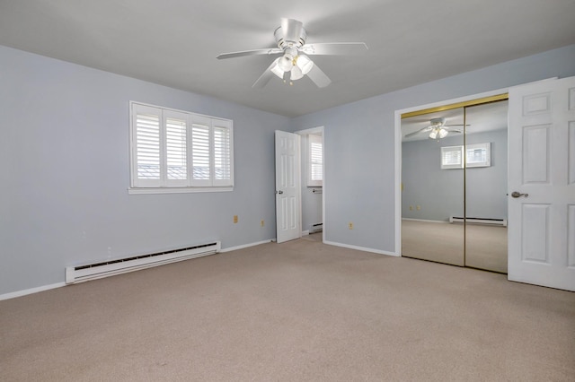 185 Kings Hwy, Hampton, NH 03842 - unfurnished bedroom featuring a baseboard heating unit, a baseboard radiator, carpet flooring, and baseboards