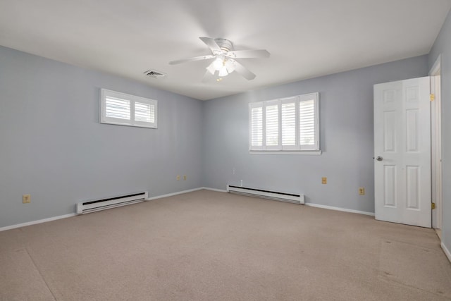 185 Kings Hwy, Hampton, NH 03842 - unfurnished bedroom with a baseboard radiator, light colored carpet, and baseboards