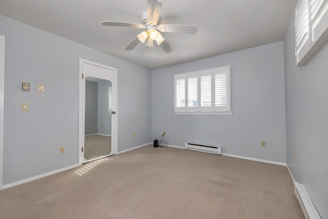 185 Kings Hwy, Hampton, NH 03842 - carpeted empty room with a baseboard heating unit, baseboard heating, ceiling fan, and baseboards