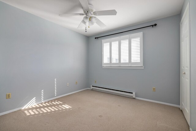 185 Kings Hwy, Hampton, NH 03842 - carpeted spare room with a baseboard radiator, ceiling fan, and baseboards