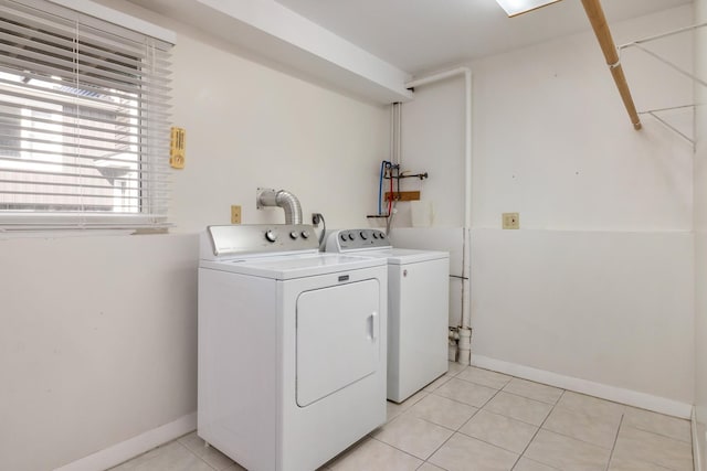 185 Kings Hwy, Hampton, NH 03842 - laundry room featuring separate washer and dryer, light tile patterned flooring, and baseboards