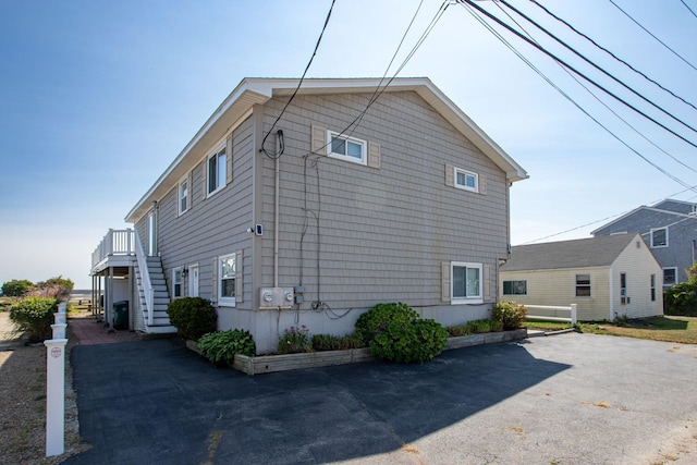 185 Kings Hwy, Hampton, NH 03842 - view of side of home featuring stairway
