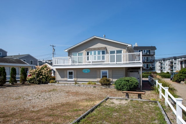 185 Kings Hwy, Hampton, NH 03842 - rear view of house featuring a balcony