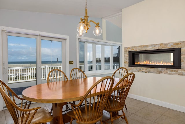 185 Kings Hwy, Hampton, NH 03842 - dining space featuring tile patterned flooring, a chandelier, and plenty of natural light