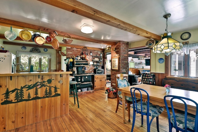 5100 Rte 100, Plymouth, VT 05056 - dining space with brick wall, wood-type flooring, beamed ceiling, and decorative columns
