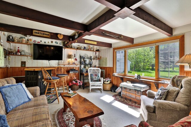 5100 Rte 100, Plymouth, VT 05056 - living room featuring wooden walls, a wainscoted wall, beamed ceiling, and carpet flooring