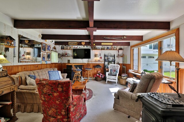 5100 Rte 100, Plymouth, VT 05056 - carpeted living room featuring wooden walls and beamed ceiling