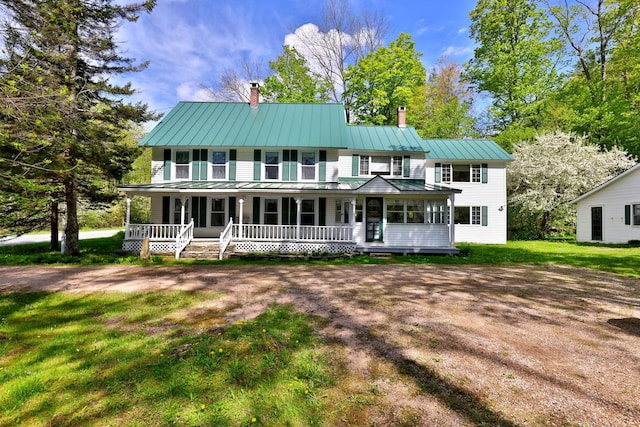 5100 Rte 100, Plymouth, VT 05056 - view of front facade featuring a chimney, covered porch, a standing seam roof, and a front yard