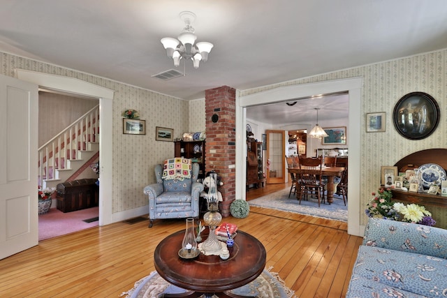 5100 Rte 100, Plymouth, VT 05056 - living room featuring wallpapered walls, a chandelier, hardwood / wood-style floors, and stairway