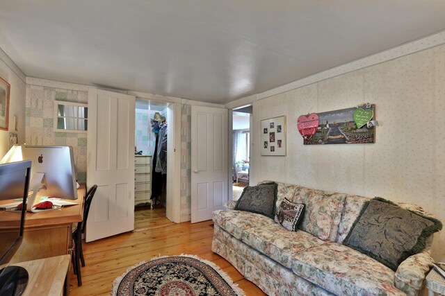 5100 Rte 100, Plymouth, VT 05056 - living room with light wood-style flooring, an office area, and wallpapered walls