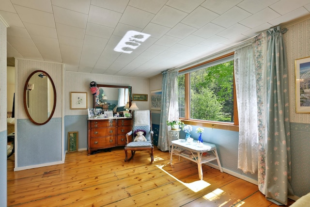 5100 Rte 100, Plymouth, VT 05056 - living area with wallpapered walls, hardwood / wood-style flooring, baseboards, and ornamental molding