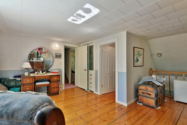 5100 Rte 100, Plymouth, VT 05056 - bedroom featuring wallpapered walls and light wood-style flooring