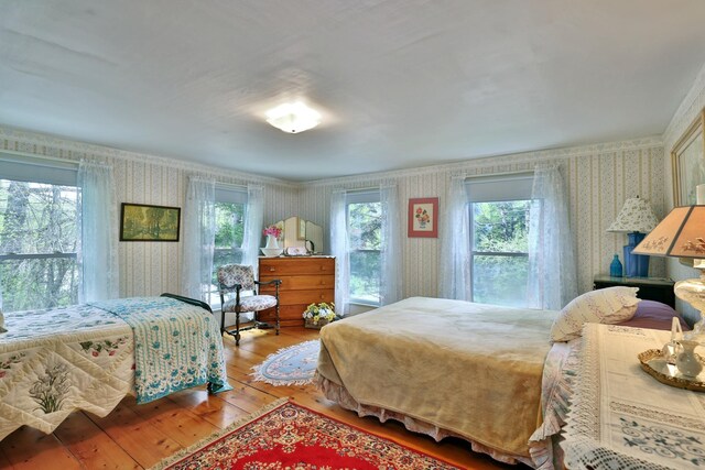 5100 Rte 100, Plymouth, VT 05056 - bedroom with wallpapered walls and hardwood / wood-style floors