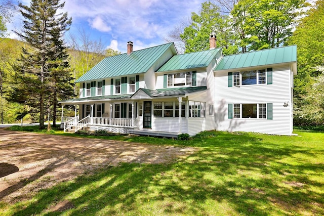 5100 Rte 100, Plymouth, VT 05056 - back of property with a standing seam roof, a chimney, covered porch, and metal roof