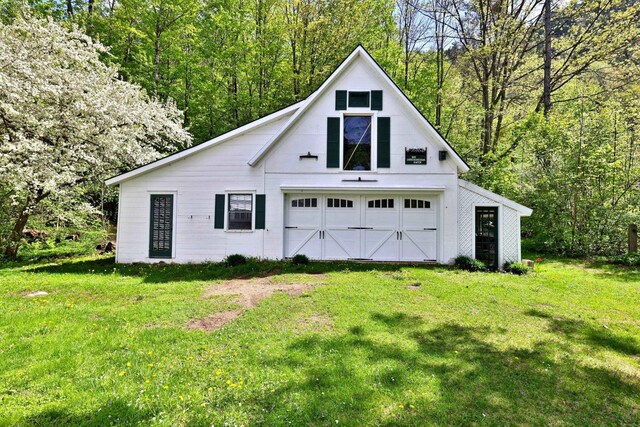 5100 Rte 100, Plymouth, VT 05056 - garage with a garage and a forest view
