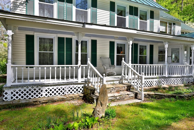 5100 Rte 100, Plymouth, VT 05056 - doorway to property featuring covered porch, metal roof, a chimney, and a standing seam roof