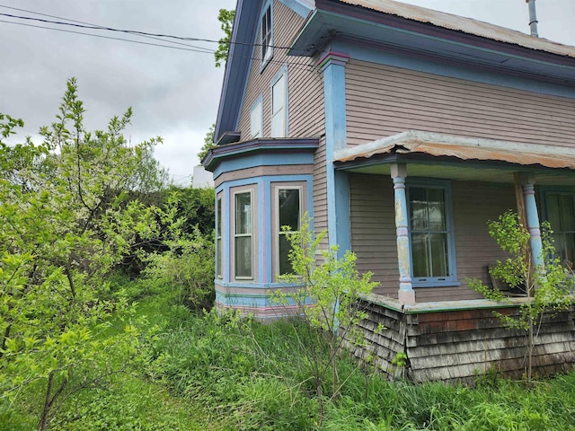 16 Northridge Rd, Burke, VT 05871 - view of side of home with covered porch and metal roof
