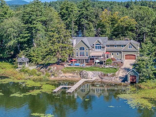 11 Clark Island Rd, Amherst, NH 03031 - aerial view of property and surrounding area featuring a heavily wooded area and a nearby body of water