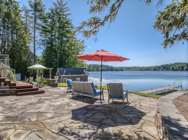 11 Clark Island Rd, Amherst, NH 03031 - view of patio / terrace featuring an outdoor structure, a water view, and a boat dock
