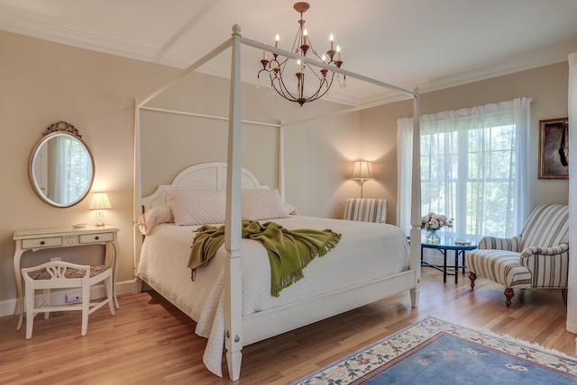 11 Clark Island Rd, Amherst, NH 03031 - bedroom featuring crown molding, a chandelier, wood finished floors, and baseboards