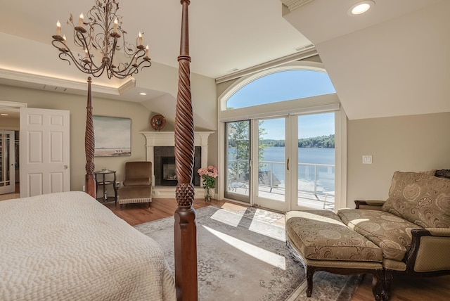 11 Clark Island Rd, Amherst, NH 03031 - bedroom with access to outside, wood finished floors, a chandelier, a fireplace, and a water view