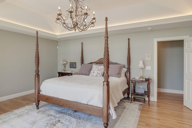 11 Clark Island Rd, Amherst, NH 03031 - bedroom with light wood finished floors, a chandelier, and baseboards