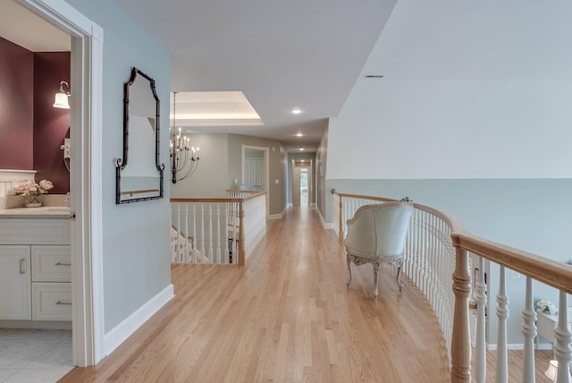 11 Clark Island Rd, Amherst, NH 03031 - hall with an upstairs landing, a chandelier, light wood-style flooring, baseboards, and recessed lighting