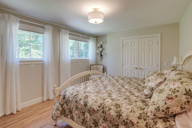 11 Clark Island Rd, Amherst, NH 03031 - bedroom featuring light wood-type flooring, a closet, and baseboards